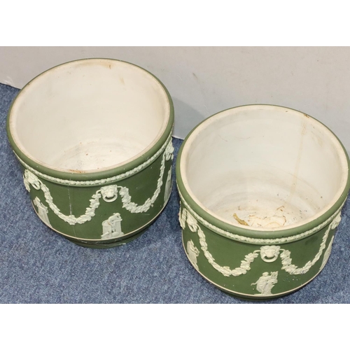 181 - A pair of Wedgwood Jasperware round bulbous jardinières on green and white ground with raised classi... 