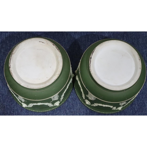 181 - A pair of Wedgwood Jasperware round bulbous jardinières on green and white ground with raised classi... 