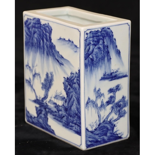 21 - An Oriental rectangular brick shaped brush pot on blue and white ground with river landscape, buildi... 