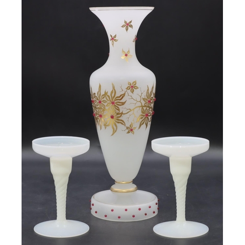 3 - A 19th Century Opaline round bulbous thin necked trumpet shaped vase (chip to rim) with raised red s... 