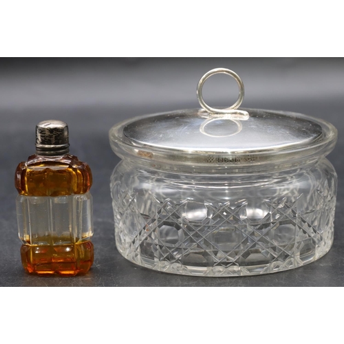 34 - An amber and clear glass small scent bottle with silver coloured metal screw lid enclosing inner sto... 