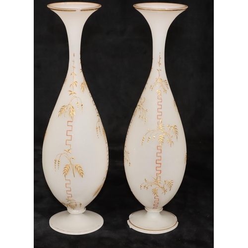 36 - A pair of Opaline round bulbous thin necked trumpet shaped vases with raised key pattern and gilt de... 