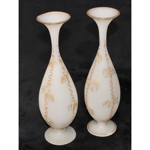 36 - A pair of Opaline round bulbous thin necked trumpet shaped vases with raised key pattern and gilt de... 