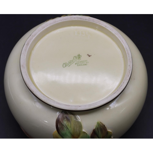 39 - A Clarice Cliff round bulbous fruit bowl on cream ground with raised coloured leaf and scroll decora... 