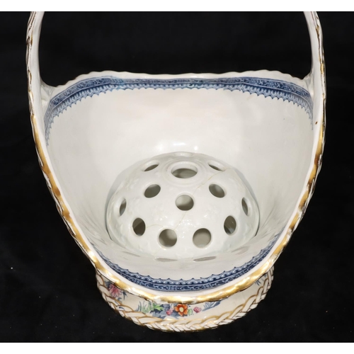 42 - A china basket shaped vase with inner frog block on white ground with multi-coloured floral, leaf an... 