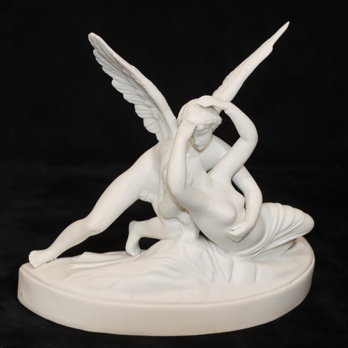 45 - A German Parian group, female nude supported by an Angel, on half round base, 19cm wide, 17cm high (... 