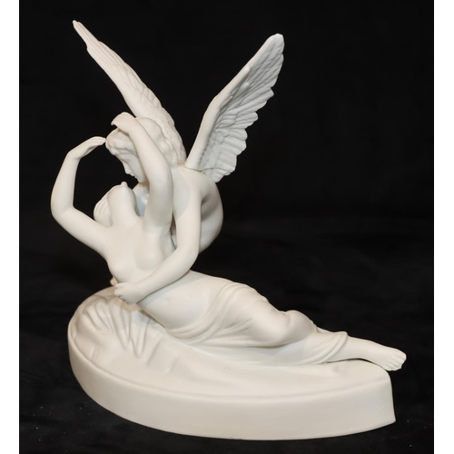 45 - A German Parian group, female nude supported by an Angel, on half round base, 19cm wide, 17cm high (... 