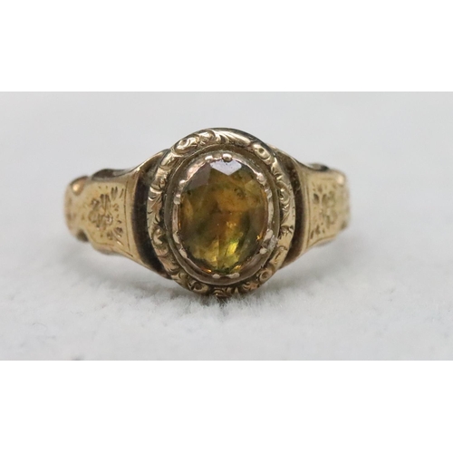 520 - A 19th Century gold ring set with Citrine style stone with allover chased floral and leaf decoration... 