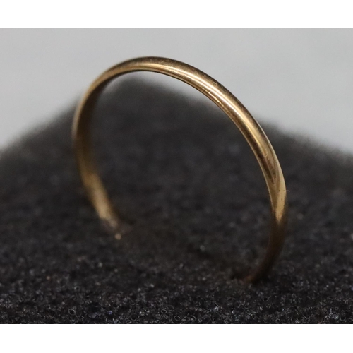 521 - A gold wedding ring, Size N/O, 1.1 grams