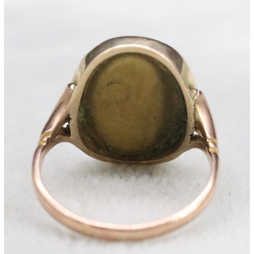 552 - A 9ct gold oval cameo ring depicting figurehead (repair to left hand side), Size R, 4.2 grams gross