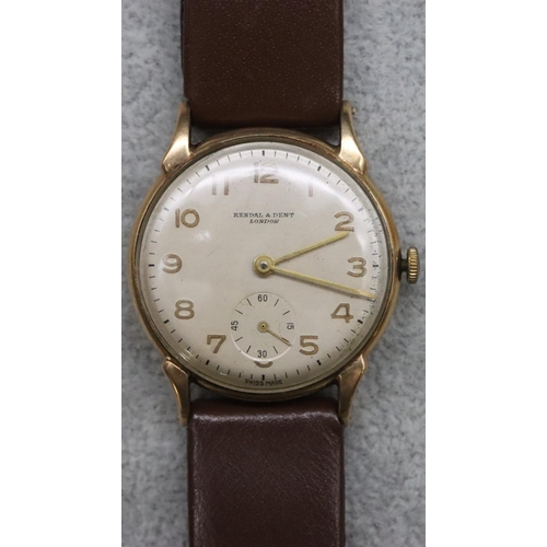 559 - Kendal & Dent, London, 9ct gold circular wristwatch with silvered dial, seconds dial and Arabic nume... 