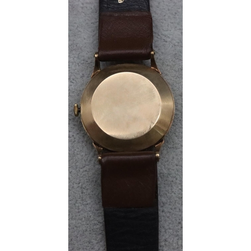 559 - Kendal & Dent, London, 9ct gold circular wristwatch with silvered dial, seconds dial and Arabic nume... 