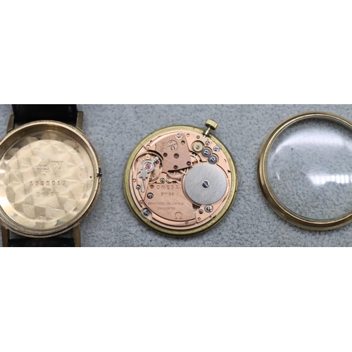 559 - Kendal & Dent, London, 9ct gold circular wristwatch with silvered dial, seconds dial and Arabic nume... 