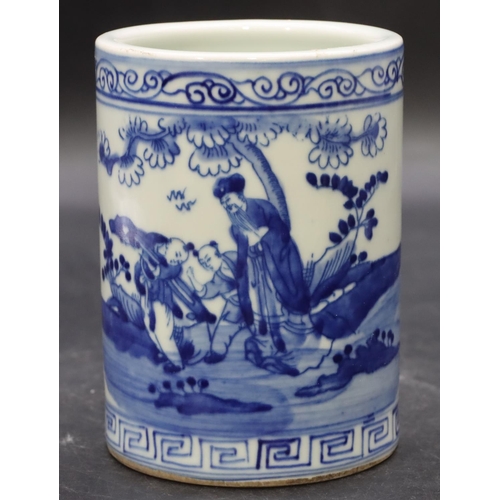 56 - An Oriental cylindrical brush pot on blue and white ground with figure and landscape decoration, 12.... 