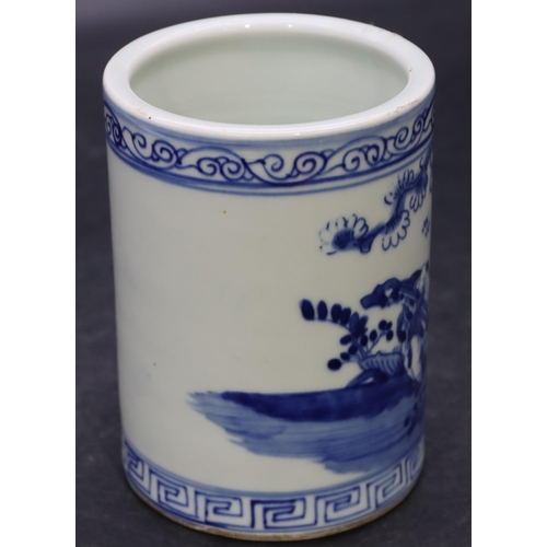 56 - An Oriental cylindrical brush pot on blue and white ground with figure and landscape decoration, 12.... 