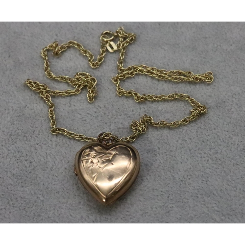 566 - A 9ct gold front and back heart shaped locket with embossed floral motif, mounted on 9ct gold chain ... 