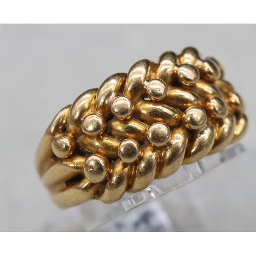 570 - An 18ct gold entwined ring, Size J/K, 13.1 grams