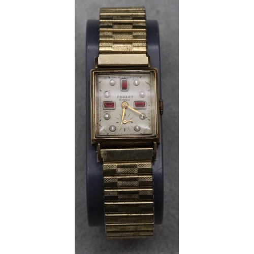 572 - A 14ct gold Chalet 17 jewel wristwatch with seconds dial, mounted with red and white paste stones an... 