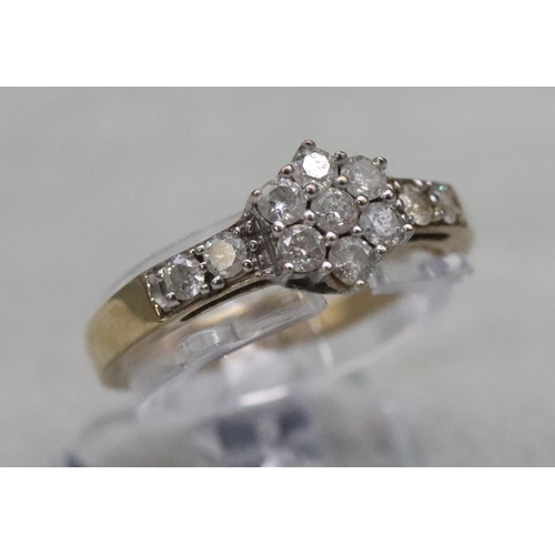 585 - A 9ct gold cluster ring set with small diamonds, Size N, 2.3 grams gross