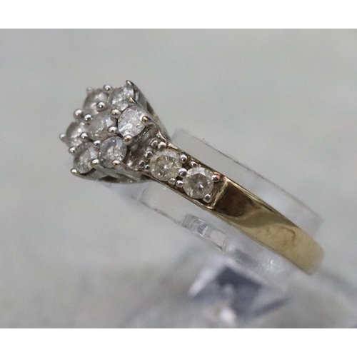 585 - A 9ct gold cluster ring set with small diamonds, Size N, 2.3 grams gross