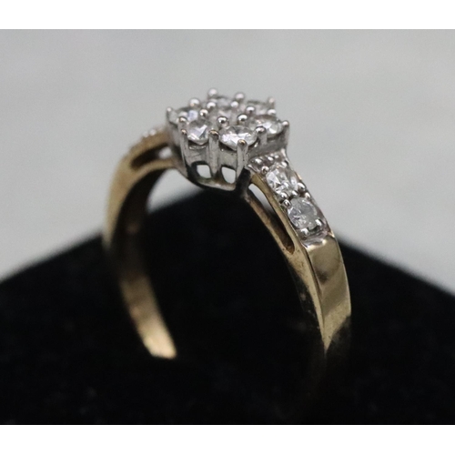 585 - A 9ct gold cluster ring set with small diamonds, Size N, 2.3 grams gross