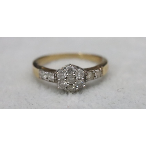 585 - A 9ct gold cluster ring set with small diamonds, Size N, 2.3 grams gross