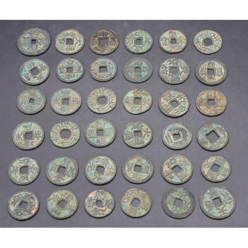 586 - 36 various Chinese style coins