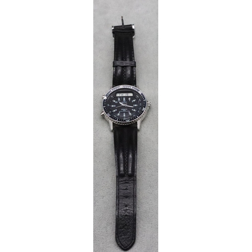 599 - A Seiko Quartz Sports 100 Alarm Chronograph wristwatch with black dial and leather strap (working)