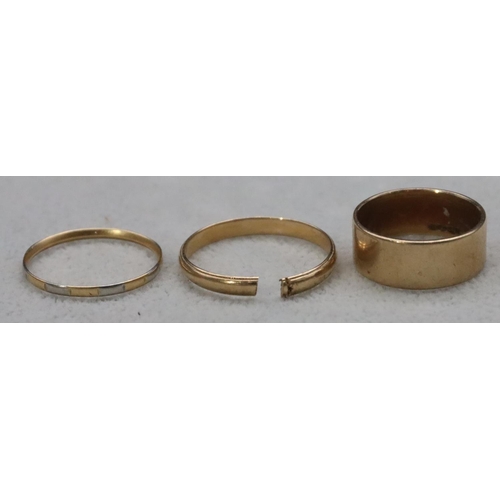 602 - A 14ct gold wedding ring (cut), 2.6 grams, a 9ct gold wedding ring, Size R, 5.4 grams and another 2-... 