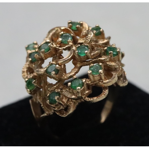 603 - A 9ct gold cluster ring set with various green stones, Size O/P, 8.8 grams gross