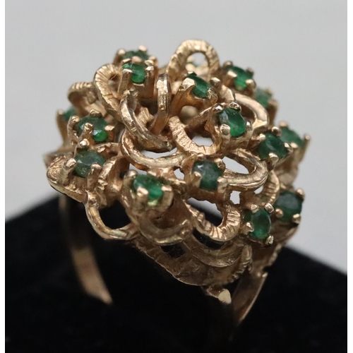 603 - A 9ct gold cluster ring set with various green stones, Size O/P, 8.8 grams gross