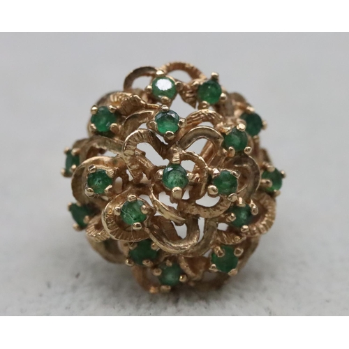 603 - A 9ct gold cluster ring set with various green stones, Size O/P, 8.8 grams gross