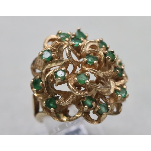 603 - A 9ct gold cluster ring set with various green stones, Size O/P, 8.8 grams gross