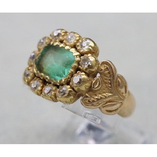 604 - A Georgian gold ring set with Peridot style green stone surrounded by 11 diamonds, Size Q/R, 6.9 gra...