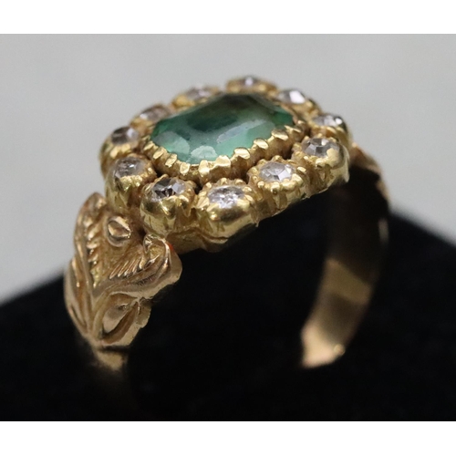 604 - A Georgian gold ring set with Peridot style green stone surrounded by 11 diamonds, Size Q/R, 6.9 gra... 