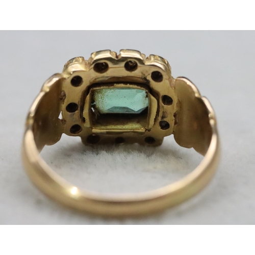 604 - A Georgian gold ring set with Peridot style green stone surrounded by 11 diamonds, Size Q/R, 6.9 gra... 