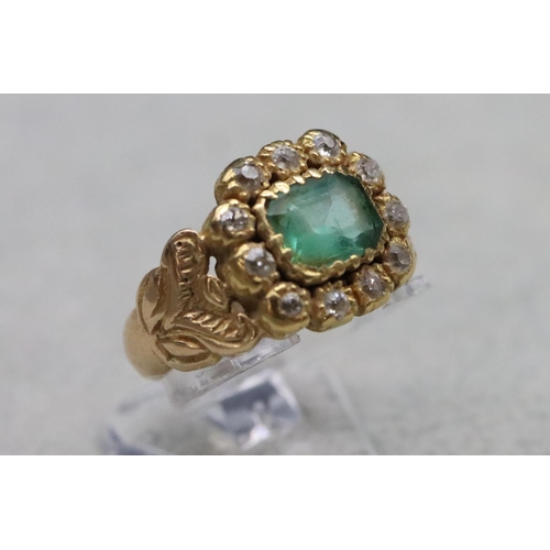 604 - A Georgian gold ring set with Peridot style green stone surrounded by 11 diamonds, Size Q/R, 6.9 gra... 