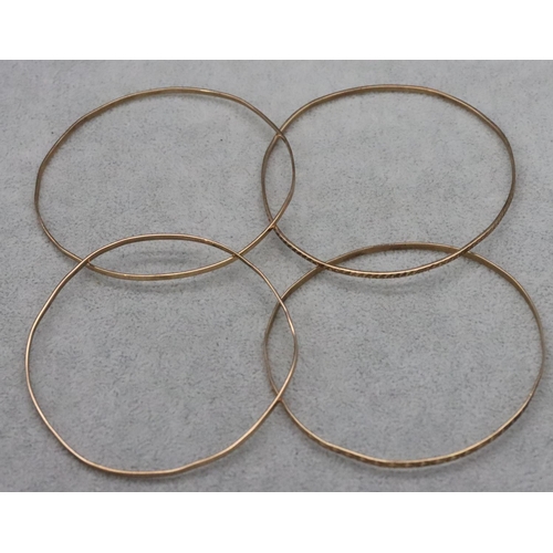 606 - 4 various 9ct gold bangles, 15.9 grams