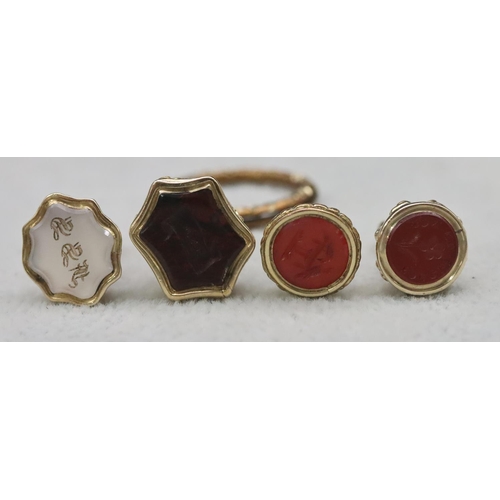 615 - 4 small gold pendant seals, all set with coloured stones, largest 2.3cm high, 9.8 grams gross and a ... 