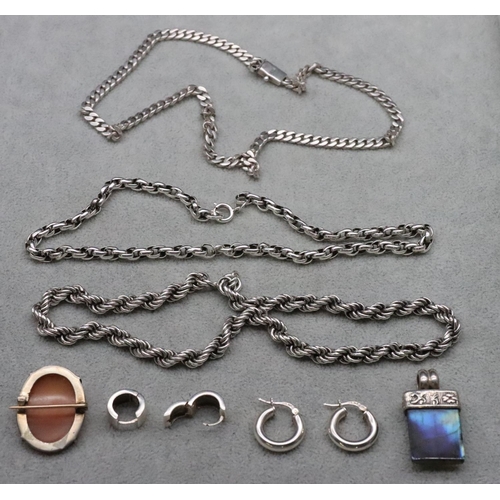 622 - A silver rope necklace and 2 further silver necklaces, a silver drop pendant, a silver mounted oval ... 