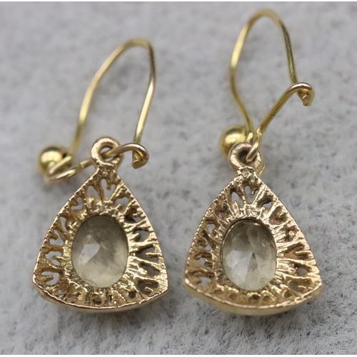 653 - A pair of 9ct gold drop earrings set with yellow coloured stones, 1.6 grams gross