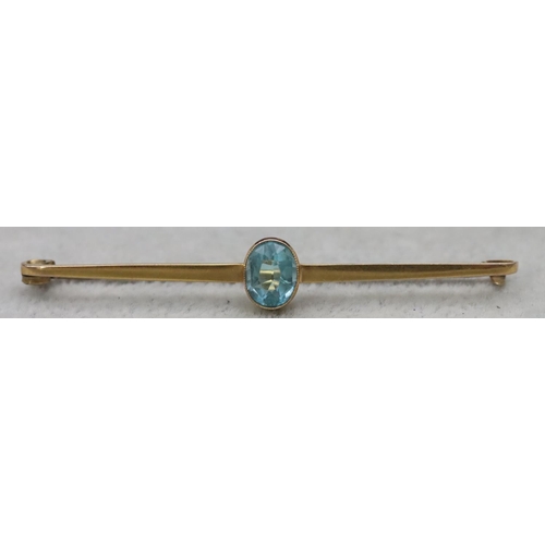 654 - A 9ct gold bar brooch mounted with centre topaz, 2.8 grams gross