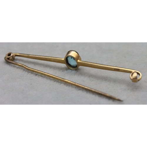 654 - A 9ct gold bar brooch mounted with centre topaz, 2.8 grams gross