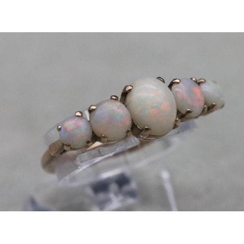 655 - A 9ct gold ladies' 5-stone opal ring, Size N, 2 grams gross