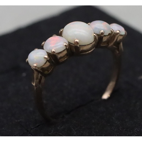 655 - A 9ct gold ladies' 5-stone opal ring, Size N, 2 grams gross