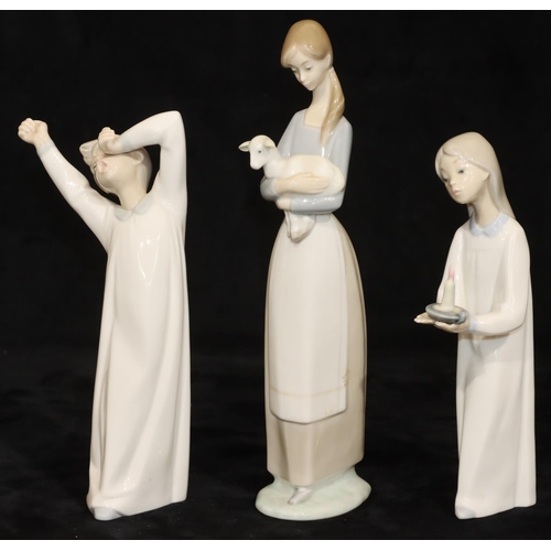 66 - 3 Lladro figures: lady carrying lamb, 27cm high, young girl holding a chamber candlestick, 20.5cm hi... 