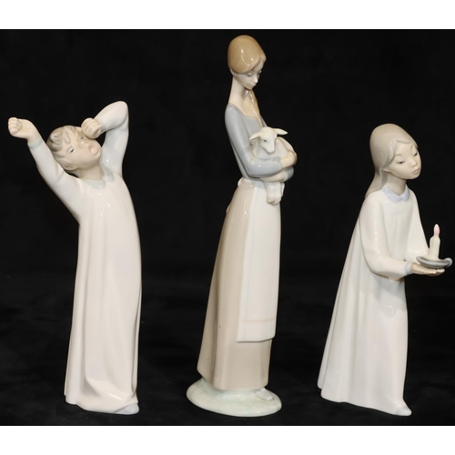 66 - 3 Lladro figures: lady carrying lamb, 27cm high, young girl holding a chamber candlestick, 20.5cm hi... 