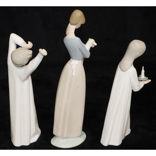 66 - 3 Lladro figures: lady carrying lamb, 27cm high, young girl holding a chamber candlestick, 20.5cm hi... 