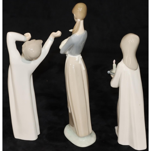 66 - 3 Lladro figures: lady carrying lamb, 27cm high, young girl holding a chamber candlestick, 20.5cm hi... 