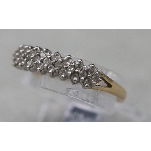 663 - A 9ct gold ladies' ring set with small diamond chips, Size L/M, 1.2 grams gross